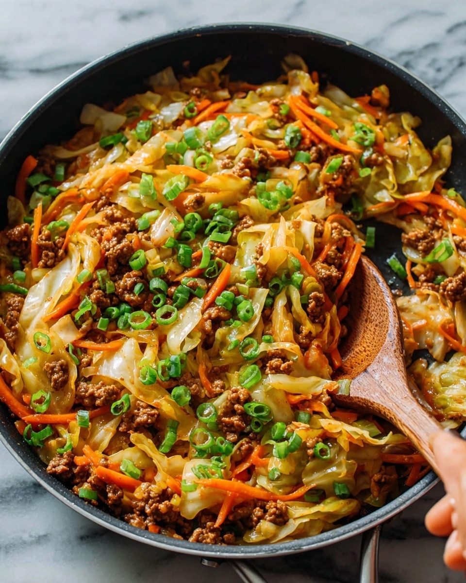 The image shows a black pan filled with a cooked dish of ground meat mixed with shredded cabbage and thin carrot strips, all cooked together with a glossy sauce. The dish is topped with chopped green onions scattered evenly across the top, and a woman's hand holding a wooden spoon is stirring the food. The pan sits on a white marbled surface. Photo taken with an iphone --ar 4:5 --v 7