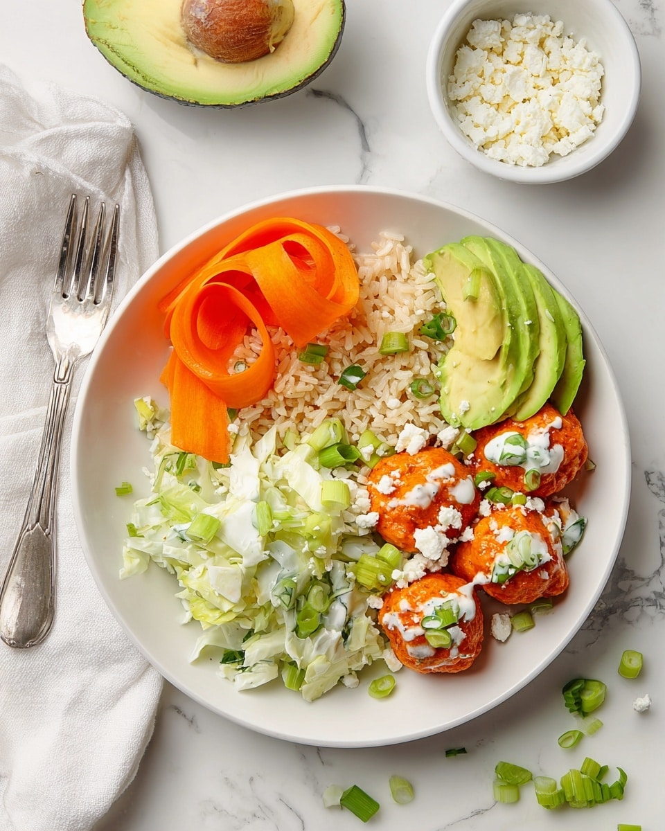 A white plate on a white marbled surface holds a colorful meal with five layers. Starting from the top left, there are thin orange carrot ribbons curled on a bed of light brown rice. Below the carrot ribbons, light green celery slices mixed with white coleslaw fill the bottom left of the plate. On the right side, bright green avocado slices are neatly fanned out. In the bottom right, five orange buffalo balls drizzled with white sauce are sprinkled with small green onion pieces and crumbled white cheese. A small white bowl of crumbled white cheese sits in the top right corner of the image near a silver fork on the right side, and half an avocado with its pit on is at the bottom. Scattered green onion pieces decorate the white marbled surface. Photo taken with an iphone --ar 4:5 --v 7