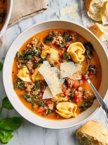 Slow Cooker Tortellini Soup with Sausage, Tomatoes, and Greens Recipe