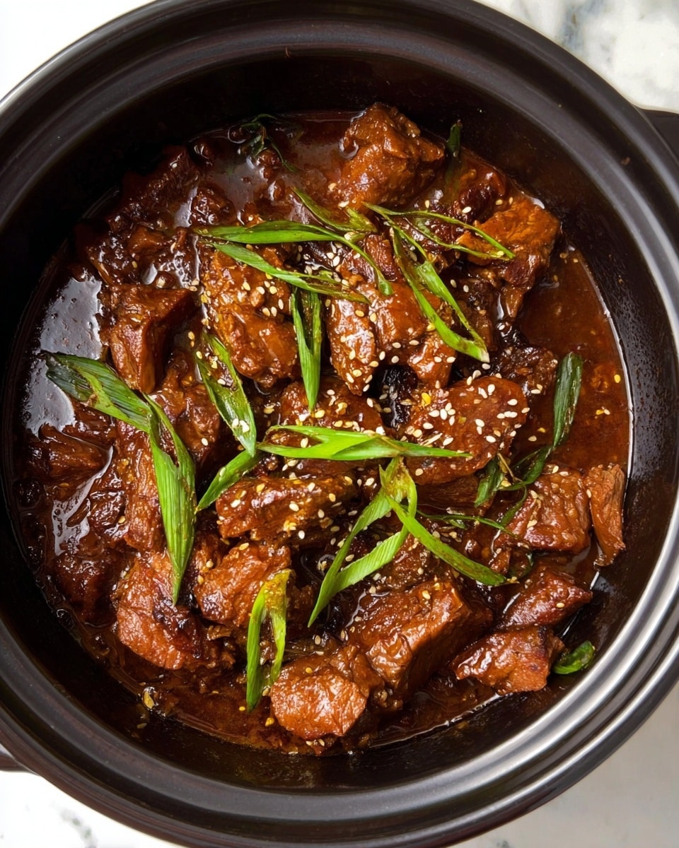 A close-up view of a dark black round pot filled with a rich, thick brown stew with chunks of tender meat layered throughout. The meat pieces have a slightly pink center and are covered in a glossy sauce. Thin green slices of scallions and small white sesame seeds are scattered on top, adding fresh color and texture. The pot sits on a white marbled surface. photo taken with an iphone --ar 4:5 --v 7