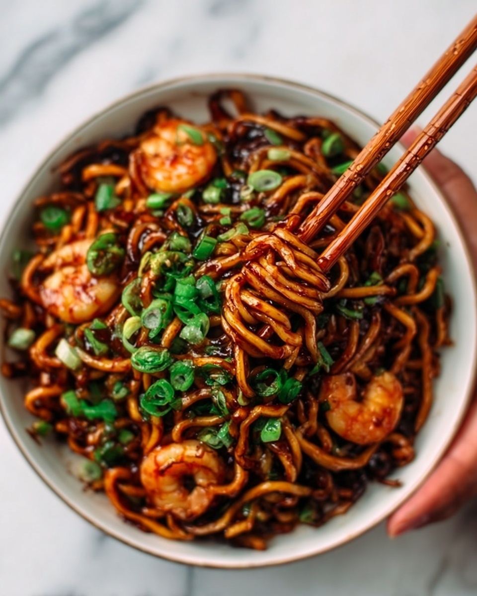 The image shows a white bowl filled with noodles coated in a dark, glossy sauce. The noodles are twisted and held by a pair of wooden chopsticks held by a woman's hand on the right side. Scattered on top are small pieces of bright green chopped scallions and a few cooked shrimp with a light orange color. The background is a white marbled texture. photo taken with an iphone --ar 4:5 --v 7