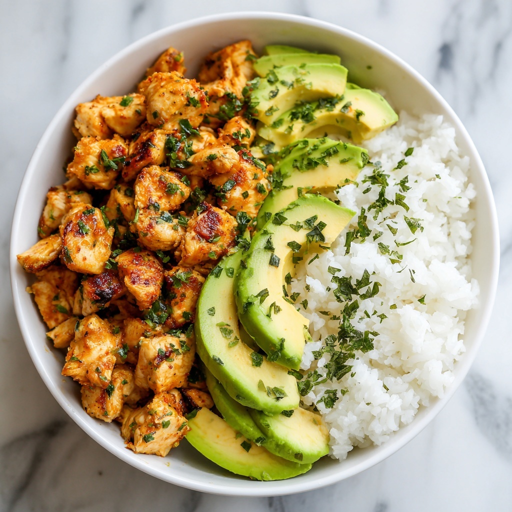 A bowl with three main layers: at the bottom, there is fluffy white rice filling about half the bowl, soft and slightly separated grains; next to the rice, sliced cucumber pieces, light green with smooth texture, arranged neatly; the top layer covers the remaining half with orange creamy chicken pieces, cooked with slight charring on some, mixed with small chopped green herbs sprinkled on top. The bowl is white, resting on a white marbled surface. Photo taken with an iphone --ar 4:5 --v 7