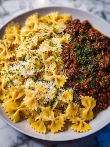 Cheesy Bowtie Pasta with Savory Cajun Ground Beef in Garlic Cream Recipe