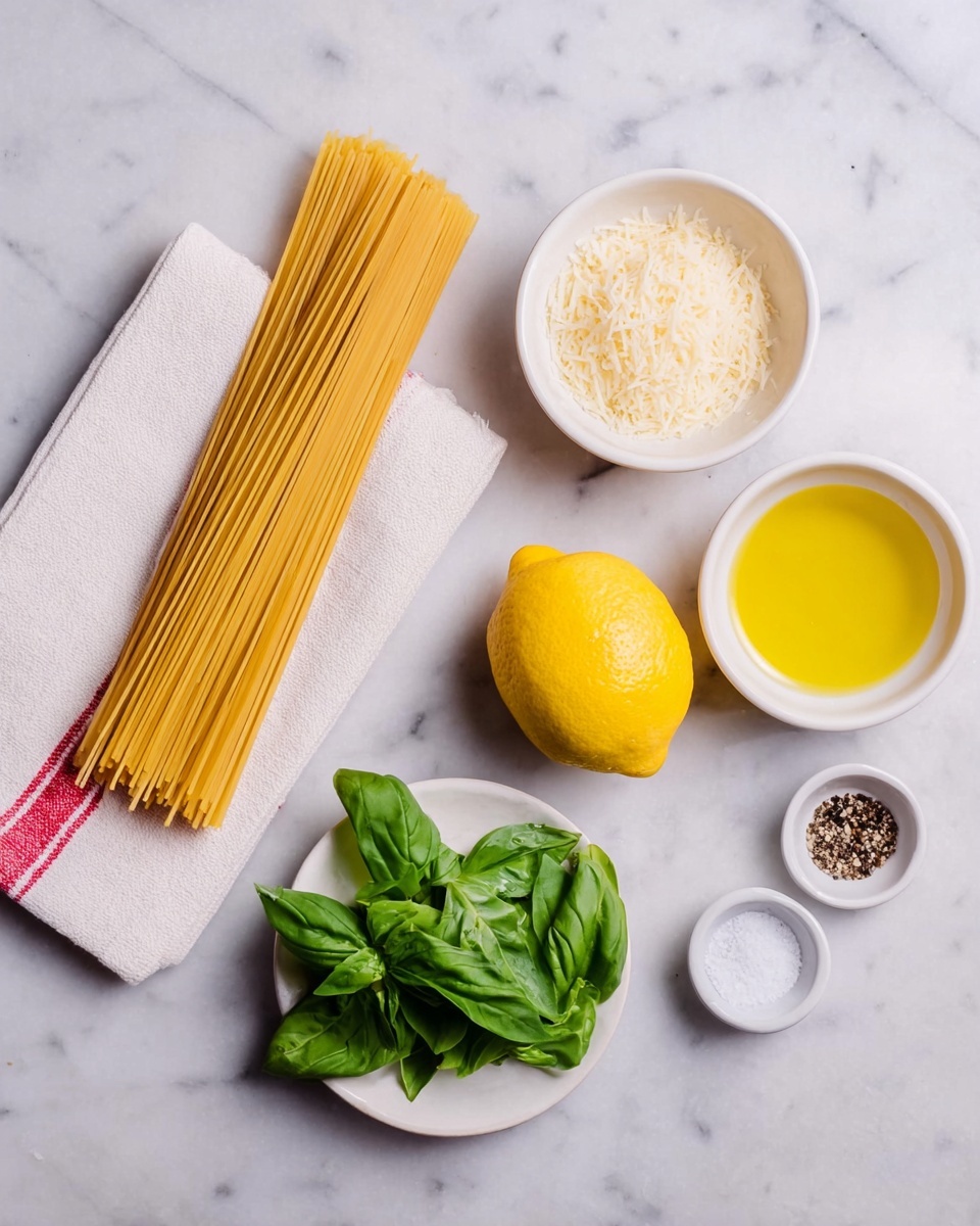 The image shows ingredients neatly arranged on a white marbled surface: a bundle of uncooked spaghetti lies on a folded white towel with red stripes on the left. To the right, there is a small white bowl filled with grated cheese, a clear white bowl with golden olive oil, and two bright yellow lemons placed side by side. Below these, a small white plate holds fresh green basil leaves with a slightly shiny texture. Two tiny white bowls contain salt and cracked black pepper, arranged at the top right in a balanced and clean layout. Photo taken with an iphone --ar 4:5 --v 7