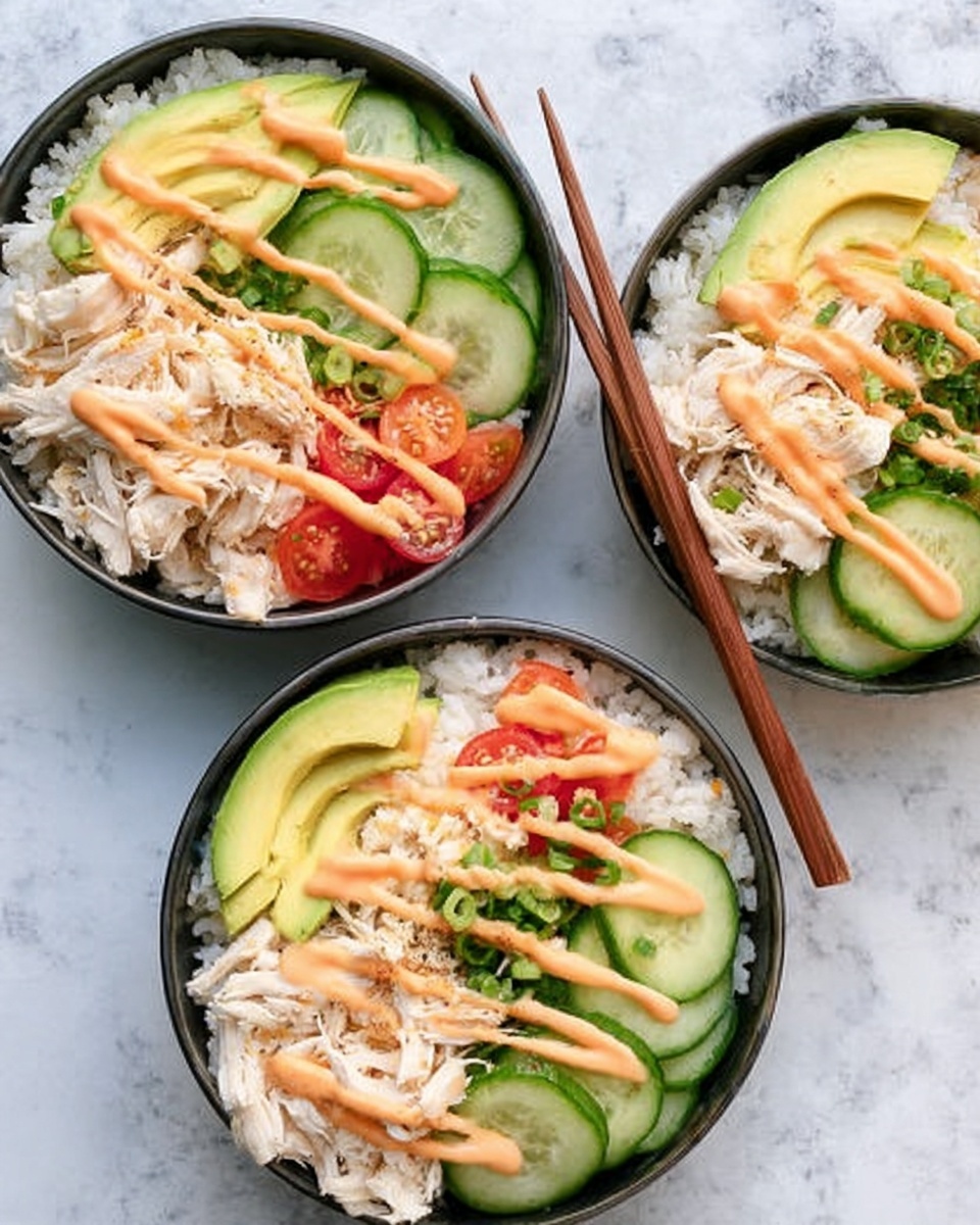 Three white bowls are filled with a layered dish. Each bowl contains a bottom layer of white rice, topped with shredded white chicken placed to one side. On another side, there are thinly sliced cucumber pieces with a light green color, and next to them, slices of pale yellow avocado arranged neatly. Small tomato pieces bring a touch of red near the chicken. All bowls have a light drizzle of creamy orange sauce on top. Wooden chopsticks rest on the edges of two of the bowls. The bowls sit on a white marbled surface. photo taken with an iphone --ar 4:5 --v 7