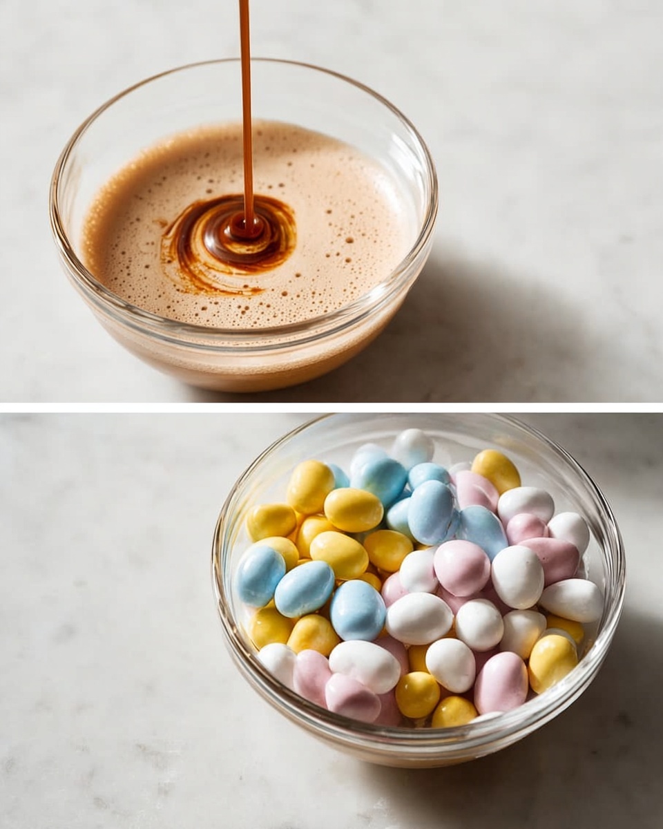 The image shows two clear glass bowls on a white marbled surface. The left bowl contains a foamy light brown liquid with a darker brown drip falling into it from above, creating a swirling pattern in the foam. The right bowl is filled with small, smooth candy eggs in pastel colors: yellow, blue, pink, and white, piled high to almost fill the bowl. The lighting is soft and natural, highlighting the texture and colors of both the liquid and candy. photo taken with an iphone --ar 4:5 --v 7