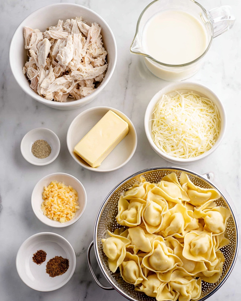 The image shows six white bowls and a white colander on a white marbled surface. Starting from the bottom right, the white colander holds yellow cooked tortellini pasta with folded shapes and slight shine. To the left, a white bowl filled with shredded pale chicken meat with a soft texture. Above it, a small white bowl contains a square block of light yellow butter. Next to it, a slightly bigger white bowl has crushed pale yellow garlic. Above that, a small white bowl contains three piles of spices: white salt, red-brown seasoning, and black pepper. To the right, a white bowl filled with shredded pale yellow cheese. Finally, at the top right, a glass measuring cup holds fresh white cream. The photo taken with an iphone --ar 4:5 --v 7