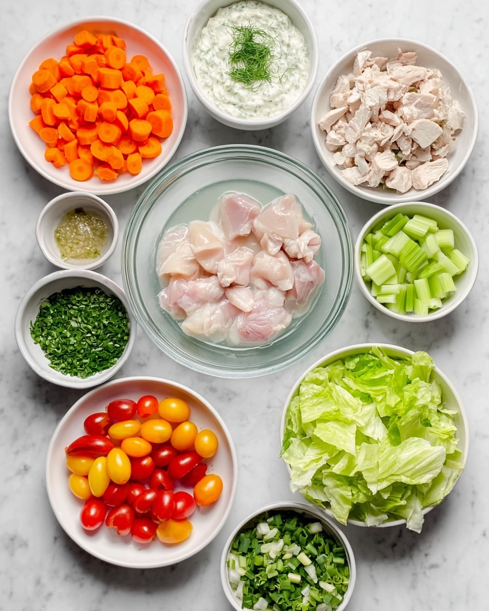 The image shows several white bowls and plates arranged on a white marbled surface. At the center is a clear glass bowl with raw chicken pieces submerged in water. Surrounding it are eight white bowls and plates holding different ingredients: bright orange diced carrots, light green sliced celery sticks, fresh light green chopped lettuce leaves, small light brown chunks of chicken, small bright red and yellow halved cherry tomatoes, green chopped scallions, finely chopped dark green herbs, and a white bowl with a creamy white sauce topped with green herbs. The colors are bright and fresh, and the layout is neat and organized. Photo taken with an iphone --ar 4:5 --v 7