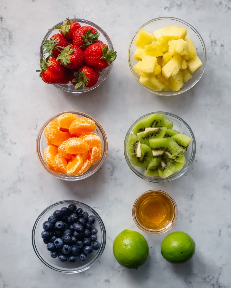 The image shows six small glass bowls and loose fruits arranged on a white marbled surface. The top left bowl contains bright red strawberries with green tops visible. To the right, there is a bowl filled with yellow pineapple chunks. Below the strawberries, a bowl holds light green kiwi fruit pieces with dark seeds. Next to the pineapple bowl is a peeled orange with orange slices arranged beside it. Below the kiwi is a small pile of dark blue blueberries. Finally, towards the bottom are two whole green limes. Near the orange is a small glass bowl of golden honey. The whole setup is placed on a clean white marbled surface, photo taken with an iphone --ar 4:5 --v 7
