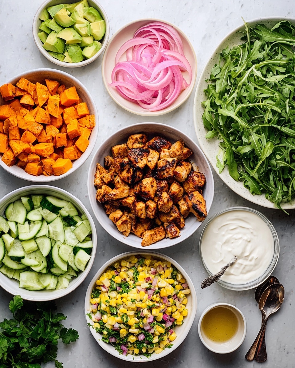 The image shows a top view of several white bowls with different fresh ingredients arranged on a white marbled surface. In the middle, there is a bowl full of grilled brown chicken pieces with a slightly charred texture. To the left, a bowl holds bright orange roasted sweet potato cubes, and above it, sliced green avocado pieces are neatly lined up. Above the avocado are chopped cucumber pieces in another bowl, and next to it is a smaller bowl with pink pickled onions. On the right side, a large bowl is filled with fresh green arugula leaves, and below it is a bowl with a yellow corn salad mixed with red onions and herbs, with a spoon inside. In the bottom center is a bowl of white, creamy sauce or dip. On the far right, there is a small bowl with a golden-colored dressing and a spoon resting inside. A bunch of fresh green herbs lies next to the sweet potato bowl. photo taken with an iphone --ar 4:5 --v 7