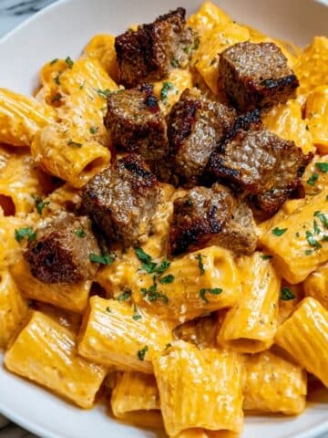 Cajun Steak Tips in Cheesy Rigatoni Parmesan Sauce Recipe