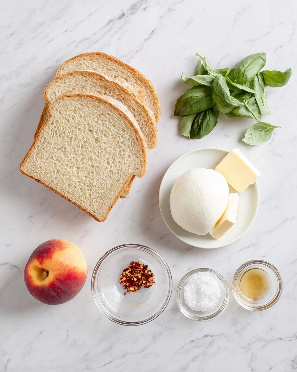 The image shows five slices of light brown bread stacked on the left side on a white marbled surface. To the right are several separate ingredients: a smooth, round white ball of mozzarella cheese near the top right, a small bunch of green basil leaves with stems next to it, a whole peach with red and yellow skin below the bread, and three small glass bowls arranged in a row at the bottom right. The bowls contain, from left to right, red chili flakes, a light brown syrup or honey, and clear white salt crystals. A small glass bowl with two square pats of pale yellow butter sits near the center. The overall setup is clean and simple with the ingredients neatly spaced. photo taken with an iphone --ar 4:5 --v 7