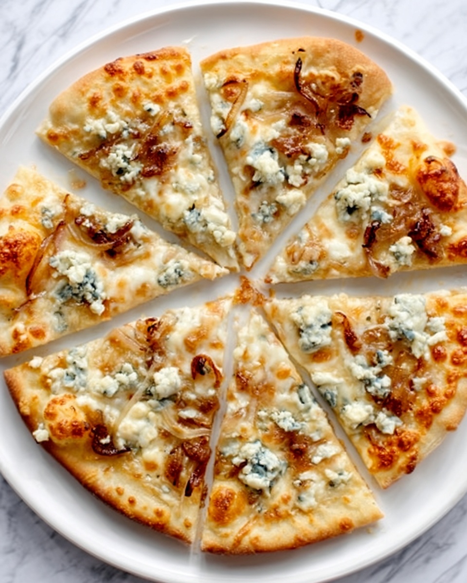 A freshly baked pizza cut into six slices on a white plate, placed on a white marbled surface. The pizza has a golden-brown crust with a slightly crispy texture. The base layer is a light, creamy sauce spread evenly, topped with melted cheese that is bubbly and slightly browned. Scattered across the pizza are uneven chunks of blue cheese with a crumbly texture and light blue-green veins. There are also small browned pieces of caramelized onions spread intermittently. The overall look is rustic with the cheese and toppings unevenly distributed, making it visually appealing. Photo taken with an iphone --ar 4:5 --v 7