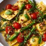 Ravioli with Tomatoes, Asparagus, Garlic, and Herbs Recipe