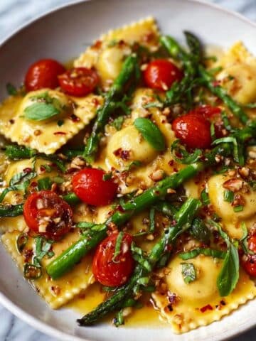 Ravioli with Tomatoes, Asparagus, Garlic, and Herbs Recipe