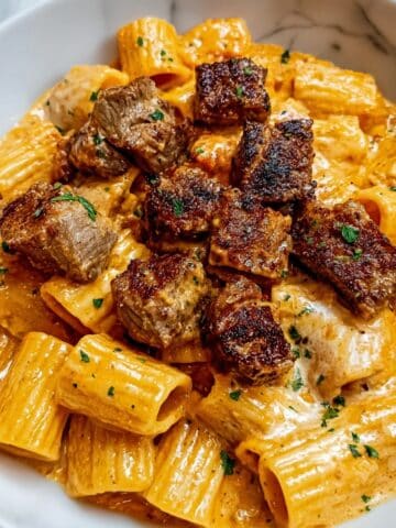 Cajun Steak Tips with Cheesy Rigatoni Parmesan Sauce Recipe