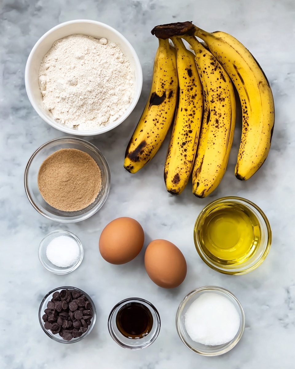 The image shows a group of ripe yellow bananas with brown spots placed on a white marbled surface near a white bowl filled with pale flour. Below them, there is a small clear glass bowl with light brown sugar, and next to it, two brown eggs rest directly on the marble. To the right, a clear glass bowl contains yellow oil. Below that are three small white containers holding white salt, dark brown vanilla extract, and white baking soda. Near the bottom left, a clear glass jar is filled with small dark chocolate chips. The ingredients are neatly arranged and viewed from above, with soft natural light creating subtle shadows. photo taken with an iphone --ar 4:5 --v 7