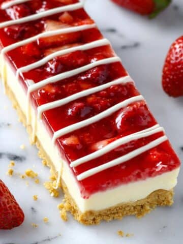 Philadelphia Cheesecake Bars with Strawberry Sauce and White Chocolate Drizzle Recipe