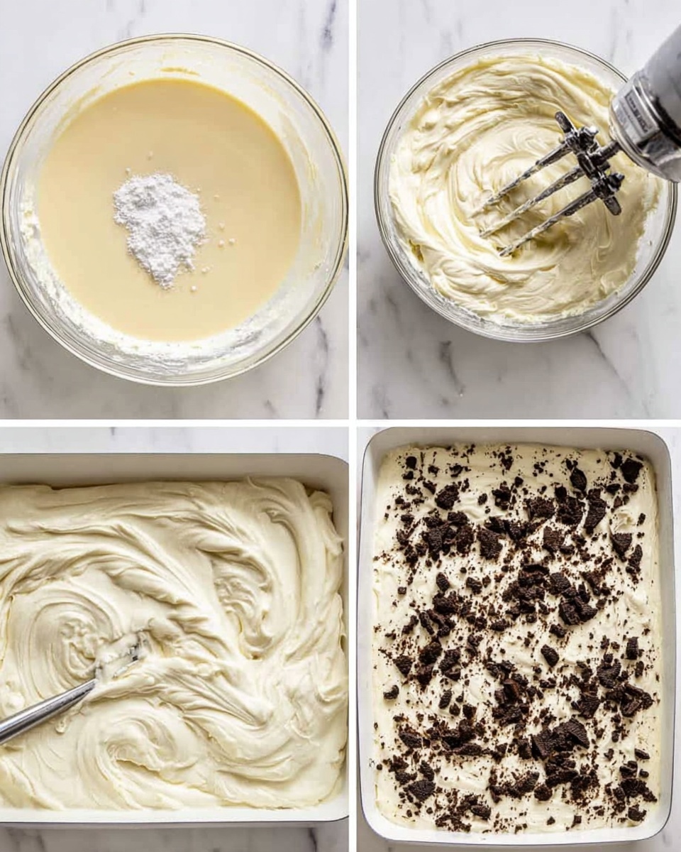 Easy No Bake Oreo Ice Cream Dessert Recipe 4 The image shows four steps of making a creamy dessert spread in a white pan on a white marbled surface. The first step has a thick, pale yellow liquid mixture with a small pile of white powder in the middle, inside a clear bowl. The second step shows the mixture whipped into a thick, fluffy cream with a silver electric mixer inside the bowl. The third step has the cream evenly spread with a spatula inside a white pan, showing smooth, swirled textures. The final step shows the creamy layer topped with crushed black and brown cookie pieces scattered all over. Photo taken with an iphone --ar 4:5 --v 7