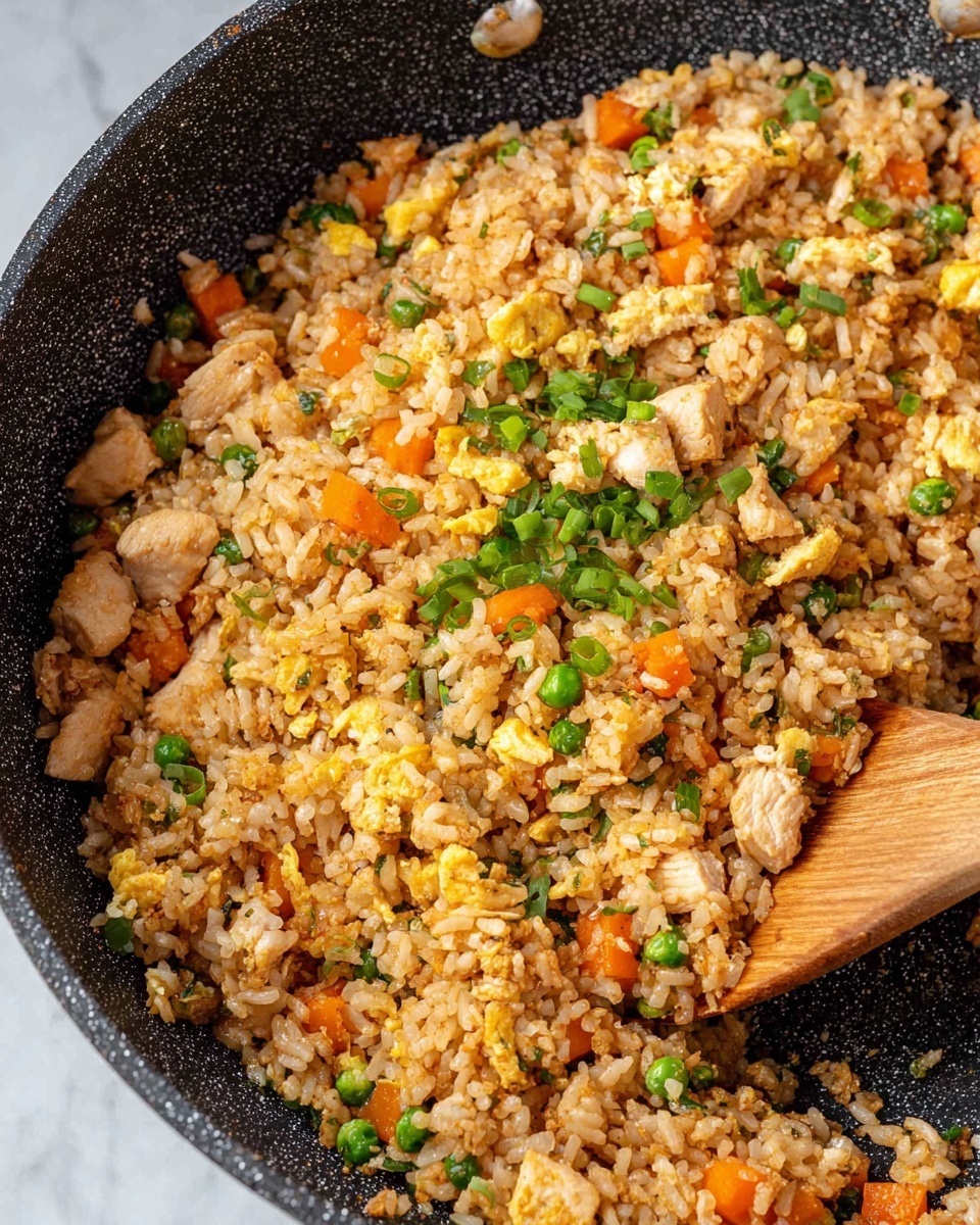 A white bowl filled with fried rice that has many layers. The bottom layer shows white to light brown rice grains mixed closely. On top, there are bright green peas and chunks of orange carrots spread evenly. Small pieces of scrambled yellow eggs are mixed well with the rice. Some soft white onion bits and light green leafy herbs are scattered throughout. A woman's hand holds a wooden spoon stirring the rice, adding a natural wooden texture to the scene. The bowl is placed on a white marbled surface. photo taken with an iphone --ar 4:5 --v 7