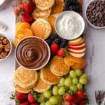 Pancake Charcuterie Board with Fresh Fruits, Nut Spreads, and Chocolate Toppings Recipe