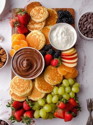Pancake Charcuterie Board with Fresh Fruits, Nut Spreads, and Chocolate Toppings Recipe