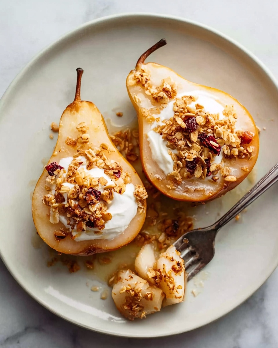 Two halves of a poached pear sit on a white plate, each topped with a dollop of creamy white yogurt in the center. Over the yogurt, there is a sprinkle of crunchy golden brown granola with small bits of dried red fruit. The pears are golden and slightly glossy with a hint of syrup pooling gently around them. A fork with a chunk of pear and yogurt rests on the side of the plate, placed on a white marbled surface. Photo taken with an iphone --ar 4:5 --v 7
