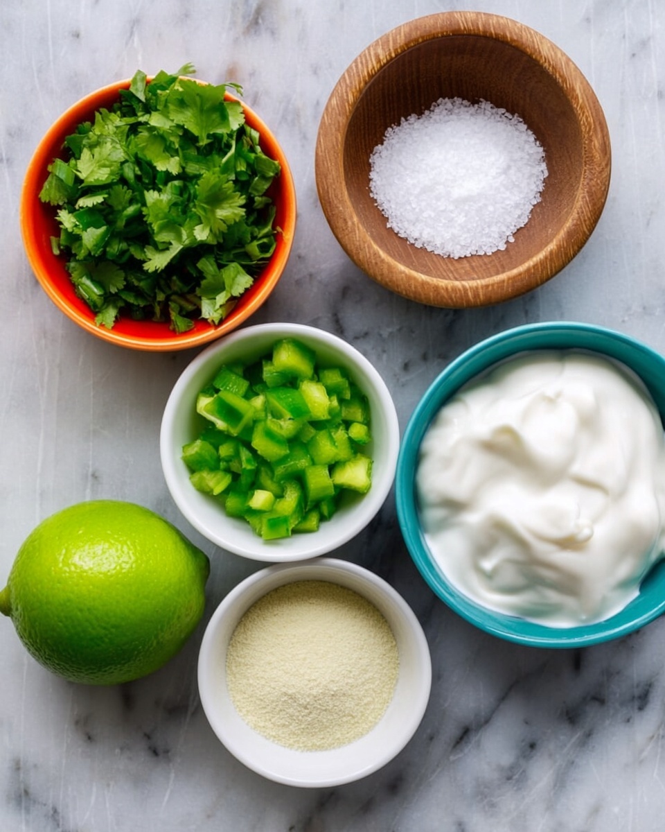 The image shows six small bowls arranged on a white marbled surface. The largest white bowl on the right side is filled with thick white creamy substance. Next to it, towards the center, there is a small wooden bowl with white granulated salt. Above it, a white bowl contains chopped green bell peppers. To the left side, there is an orange bowl full of fresh green cilantro leaves. Below, a white bowl holds a pale yellow powder, while next to it on the right is a white bowl holding a light brown powder. At the bottom left corner, a whole bright green lime is placed on the surface. The colors are fresh and bright, and the bowls are neatly arranged. Photo taken with an iphone --ar 4:5 --v 7