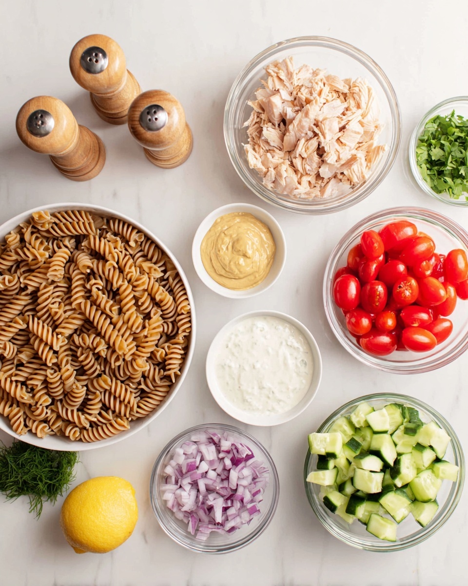 A top view of different small white bowls on a white marbled surface, arranged in a loose circle. The largest bowl at the bottom left holds brown spiral pasta. To its right, a bowl contains green diced cucumber pieces. Above the cucumber, a clear glass bowl holds light pink chunks of cooked chicken. Above the chicken, a white bowl is filled with bright red halved cherry tomatoes. Below the tomatoes, a small bowl contains chopped purple onions. Near the center, a white bowl has a smooth pale yellow mustard-like spread. To the left of the mustard bowl, a clear glass bowl contains a white creamy sauce. Above the creamy sauce, another clear bowl has a white yogurt-like creamy texture. To the left edge, two tall wooden pepper and salt shakers stand next to a small bowl of fresh green herbs. A lemon half with yellow flesh and rind is placed near the bottom right. The whole scene is clean, bright, and organized. Photo taken with an iphone --ar 4:5 --v 7