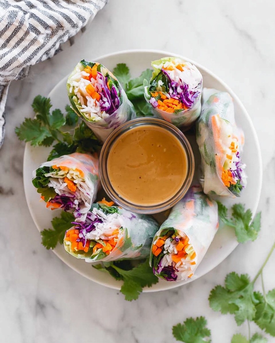 The image shows several fresh spring rolls arranged on a white marbled surface. Each roll is wrapped in translucent rice paper, revealing colorful layers inside: bright orange shrimp, green herbs, purple cabbage, and thin yellow slices of mango or bell pepper. The rolls are neatly rolled, with some showing the shrimp and others focusing more on the purple cabbage and green herbs. In the background, there is a small clear glass bowl of brown dipping sauce. The scene is bright and fresh, highlighting the translucent and vibrant textures of the spring rolls. Photo taken with an iphone --ar 4:5 --v 7