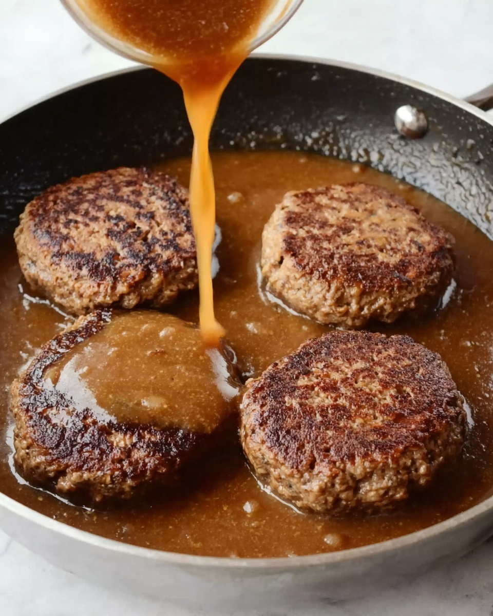 In the image, four round, brown patties with a slightly rough texture are cooking in a pan filled with a thick, brown sauce. The patties are evenly spaced in the pan, and a light brown liquid is being poured over them from above. The pan sits on a white marbled surface, adding contrast to the rich colors of the food. photo taken with an iphone --ar 4:5 --v 7