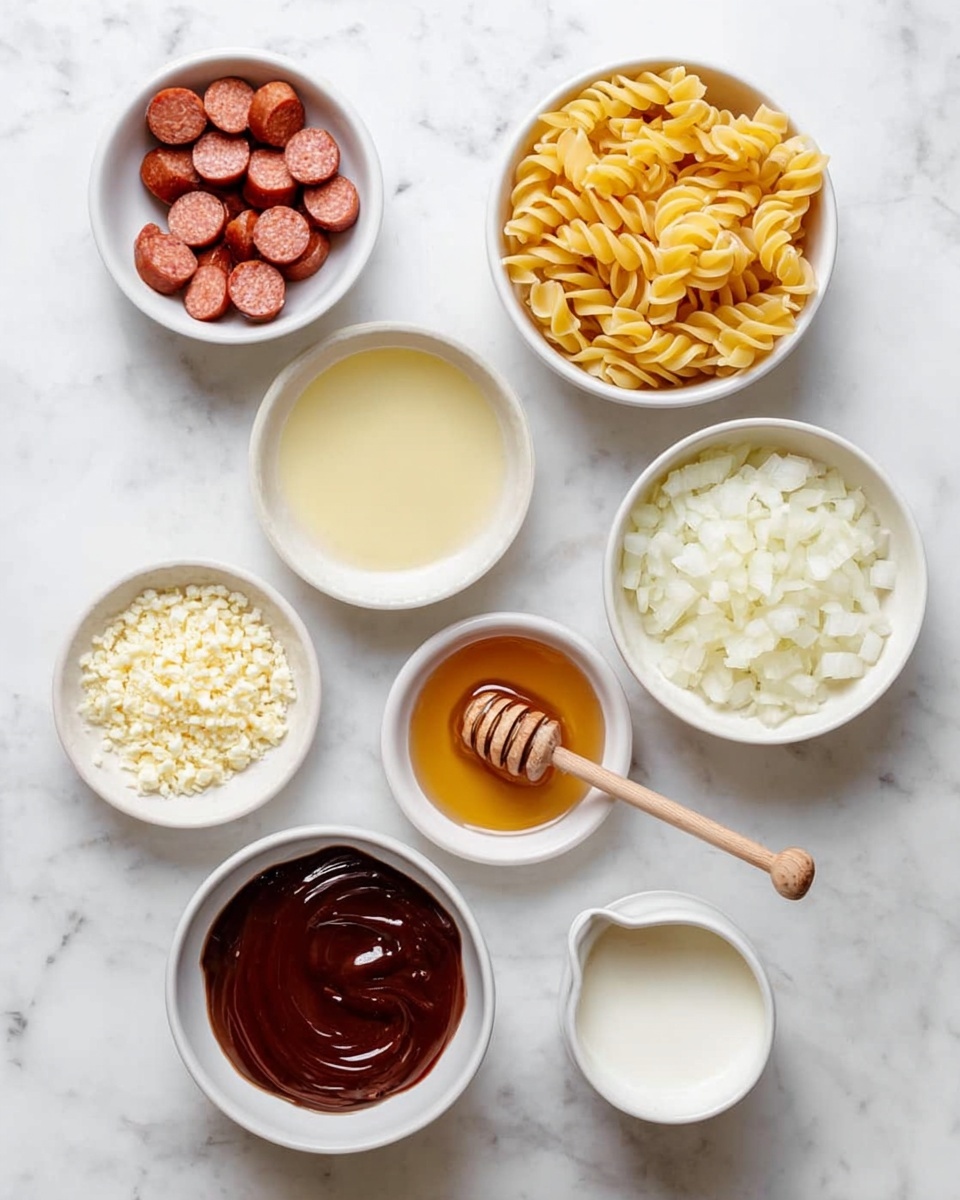 Seven white bowls are placed on a white marbled surface, each holding a different food item. The top left bowl contains slices of reddish-brown sausage arranged in a small pile. To the right, another bowl holds yellow spiral pasta neatly filled up. Below the sausage is a bowl with light yellow liquid. Next to it, a bowl is filled with finely chopped white onions. Beside the onions, a small bowl with golden honey stands out, featuring a wooden honey dipper resting on its edge. Below the honey, a bowl has a dark reddish-brown thick sauce spread smoothly on the surface. A small bowl to the left contains minced pale yellow garlic. On the right side is a small jug with white cream. The setup looks clean and organized. Photo taken with an iphone --ar 4:5 --v 7