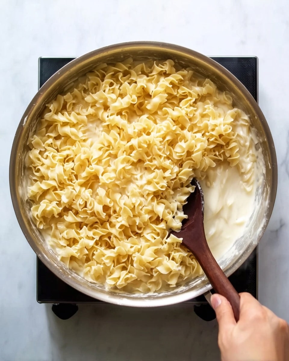 The image shows a white marbled surface with many clear glass bowls and piles of ingredients arranged neatly. There is one large bowl filled with shredded white chicken on the top left. In small bowls around it, there are bright orange spice powder, creamy white yogurt, golden raisins, sliced almonds, and salt. Near the middle, there are diced red and white pieces of apple, bright green celery slices, dark red dried cranberries, and thick sticky orange jam. Several fresh green onions lie in a bunch on the bottom left. On the right side, there is a pile of six golden-brown croissants stacked together. The whole arrangement looks bright, fresh, and colorful. Photo taken with an iphone --ar 4:5 --v 7