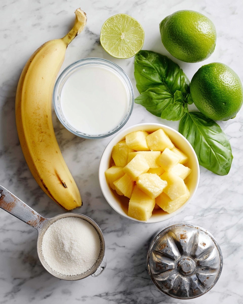 The image shows fresh ingredients laid out neatly on a white marbled surface. There is a whole ripe yellow banana and one peeled banana placed diagonally on the left side. Near the center, a clear glass contains white milk. Above the glass, several fresh green basil leaves with a smooth texture lay spread out. To the right of the basil, two whole bright green limes sit side by side, with one lime sliced in half showing its pale green inner flesh standing upright behind them. Below the limes, a white bowl is full of small frozen yellow mango chunks with a frosty texture. A metal citrus juicer with a worn silver look sits next to the limes on the right. At the bottom left corner, a metal measuring cup is filled with a fine white powdery ingredient, likely yogurt or a similar dairy product. The whole scene is clear and well-lit, capturing the fresh, natural colors and textures of the ingredients photo taken with an iphone --ar 4:5 --v 7