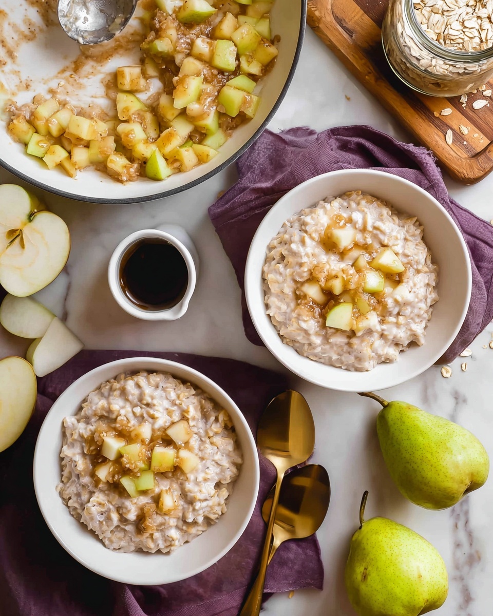 The image shows two white bowls filled with thick, creamy oatmeal mixed with small pieces of pear, placed on a dark purple cloth on a white marbled surface. Next to the bowls, there are two shiny golden spoons resting on the surface. To the upper left, there is a white pan with chopped yellowish pear pieces coated in a light brown sauce, with a metal spoon inside the pan. A small white container filled with dark liquid sits near the pan. In the upper right corner, a wooden board holds a jar filled with dry oats and a green pear nearby. Another green pear lies on the white marbled surface near the bottom right. The photo taken with an iphone --ar 4:5 --v 7