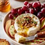 Baked Brie with Honey, Pecans, and Fresh Herbs Recipe