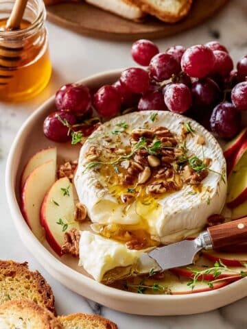 Baked Brie with Honey, Pecans, and Fresh Herbs Recipe
