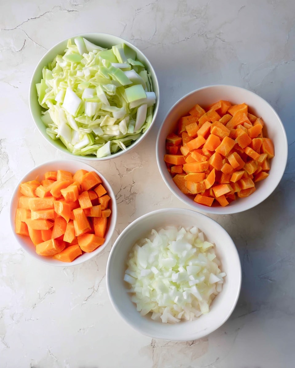 The image shows four white bowls on a white marbled surface. The largest bowl is filled with light green chopped cabbage pieces, while the second largest bowl holds small diced orange carrots. There is a medium bowl with finely chopped white onions and the smallest bowl contains minced garlic. All ingredients are neatly arranged and clearly visible from above. Photo taken with an iphone --ar 4:5 --v 7