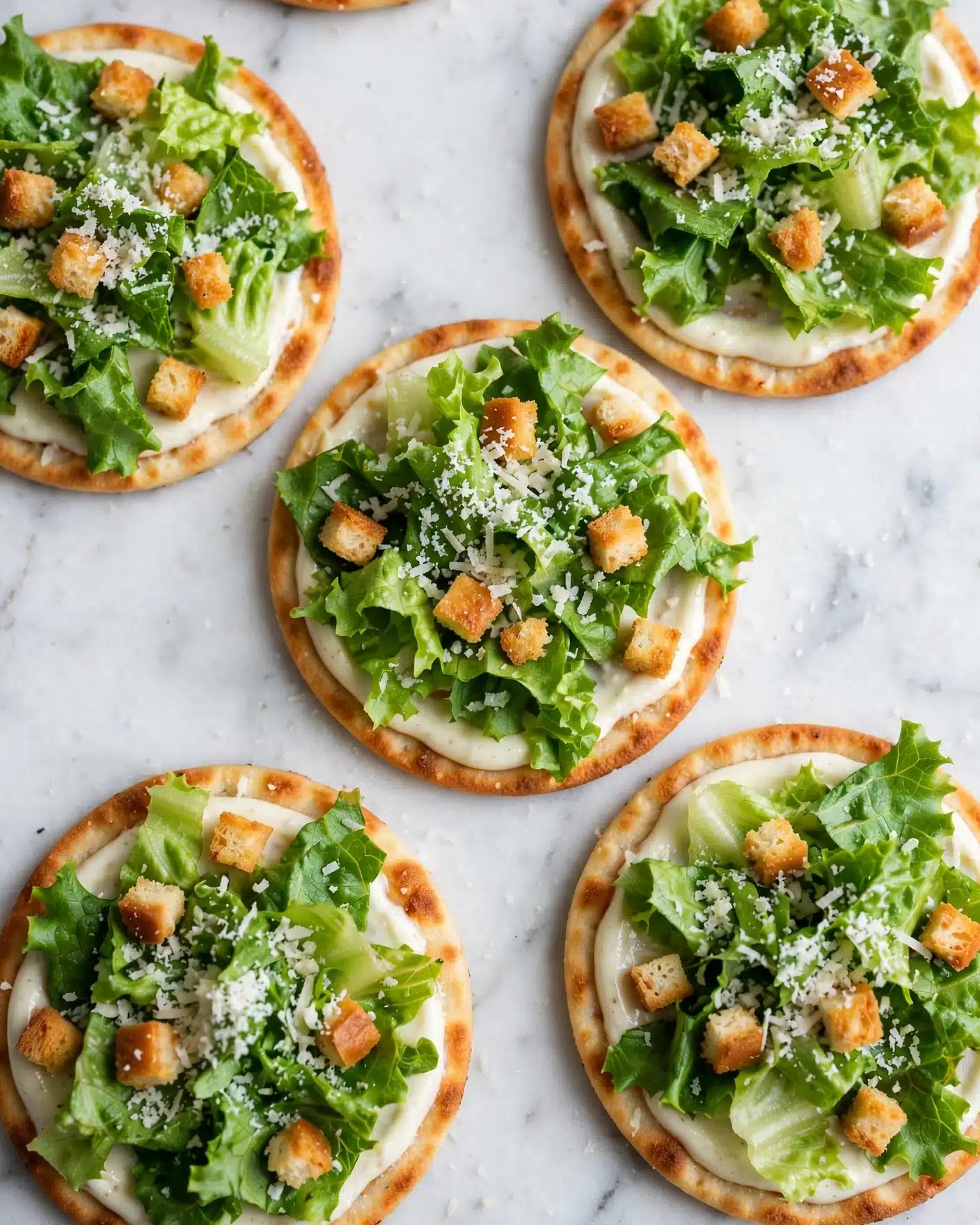 Easy Chicken Caesar Smash Tacos Recipe 4 A woman's hand is holding a soft, slightly toasted flatbread wrap that is folded open. Inside, there are two golden-brown crispy pieces, likely fried, sitting on the bottom layer. On top of these pieces, there is a fresh layer of bright green lettuce leaves with a creamy white sauce drizzled over them, some sauce dripping gently from the wrap's edge. The background has a clean white marbled texture. photo taken with an iphone --ar 4:5 --v 7